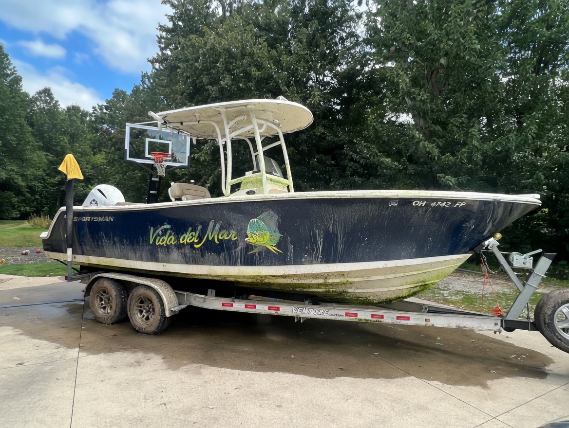 Sportsman boat before marine detail — algae and grime buildup